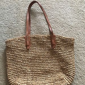 Tan straw beach bag